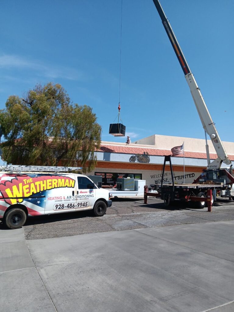 The Weatherman. Professional Heating and air conditioning system installation with a crane in Lake Havasu City