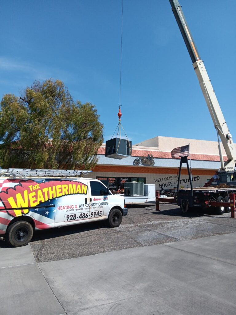 The Weatherman. Professional Heating and air conditioning system installation with a crane in Lake Havasu City