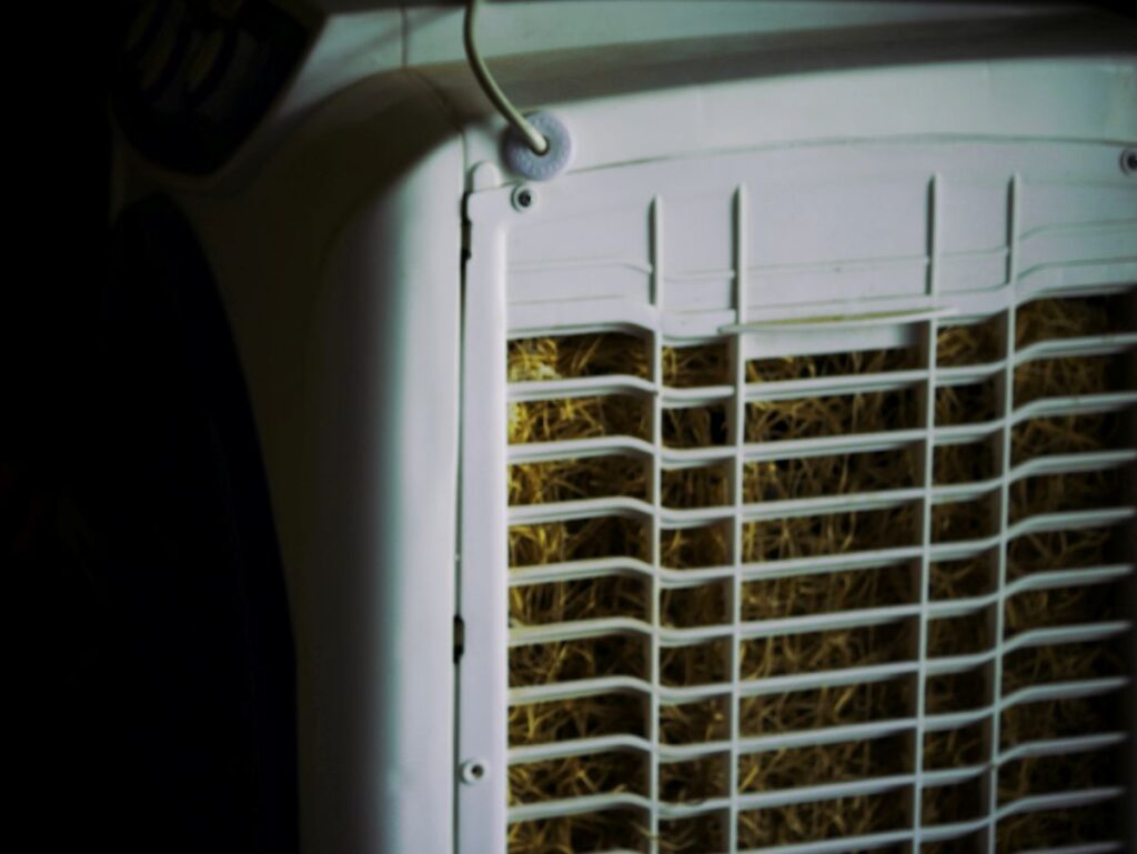 Close-up of a swamp cooler's pads at night, relevant for when you can leave a swamp cooler on all night.